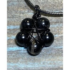 Black tourmaline beads on black copper wire wrapped pentagram
